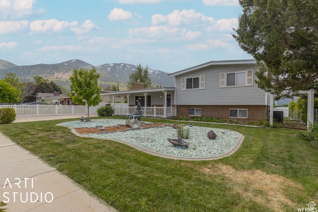 19 Sumac Way, Brigham City, UT 84302 - view of front of property featuring a front yard, fence, and a mountain view
