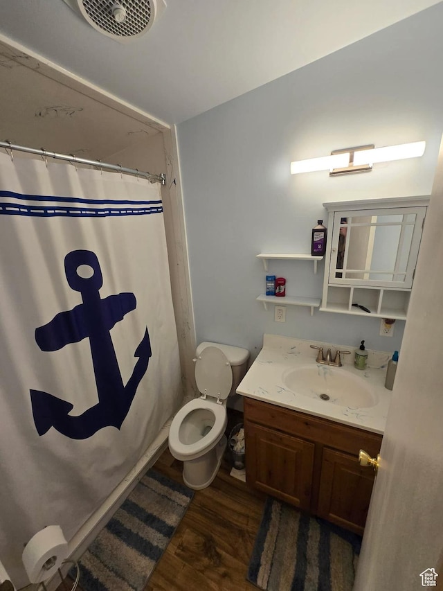 19 Sumac Way, Brigham City, UT 84302 - bathroom with vanity, a shower with shower curtain, wood finished floors, visible vents, and toilet