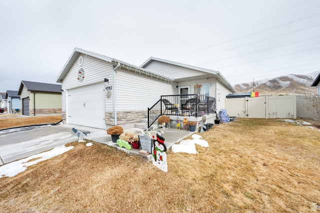 view of front of home with a garage and a front yard