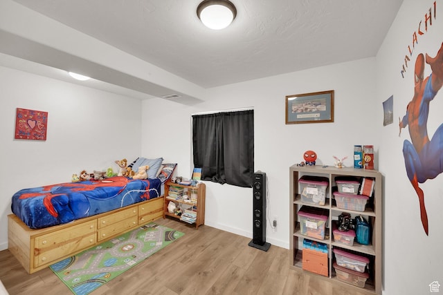 bedroom featuring light wood-type flooring