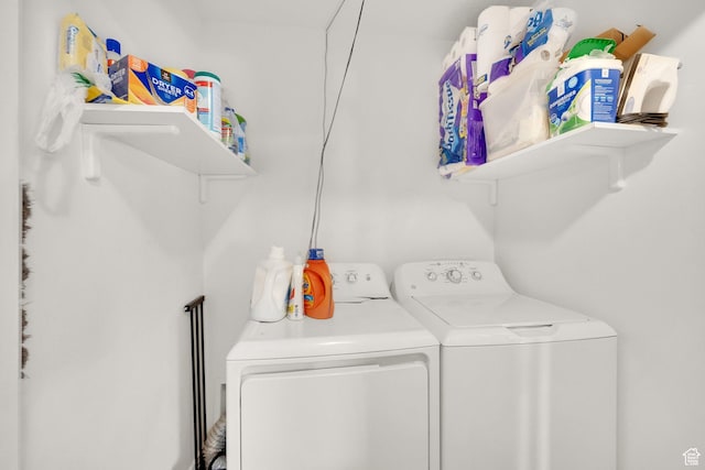 laundry room with washing machine and clothes dryer
