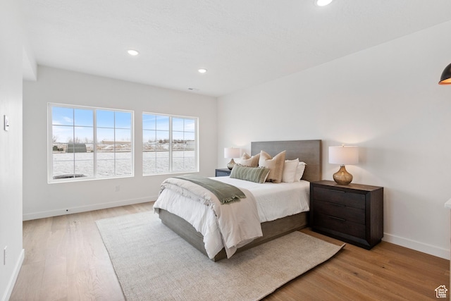 bedroom with light hardwood / wood-style flooring