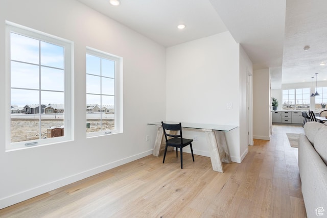 office area with light hardwood / wood-style flooring