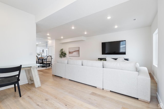 living room with light hardwood / wood-style flooring