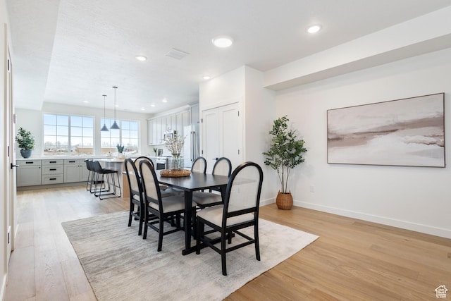dining room with light hardwood / wood-style floors