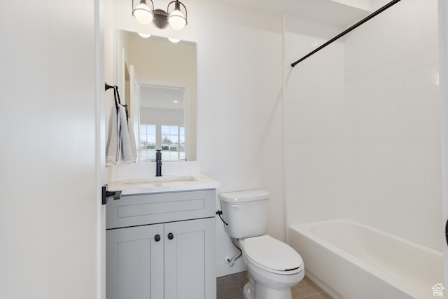full bathroom featuring tile patterned floors, toilet, vanity, and tiled shower / bath