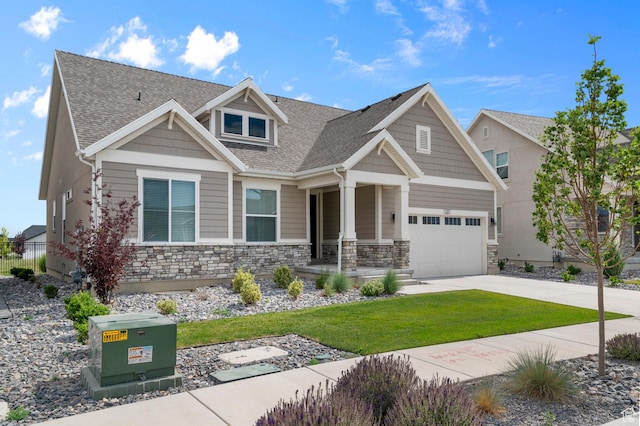 1282 E Clipper Peaks, Eagle Mountain, UT 84005 - craftsman-style home with driveway, stone siding, a front yard, a shingled roof, and a porch