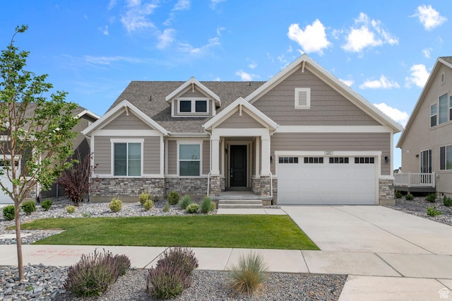 1282 E Clipper Peaks, Eagle Mountain, UT 84005 - craftsman house with concrete driveway, stone siding, an attached garage, and a front lawn