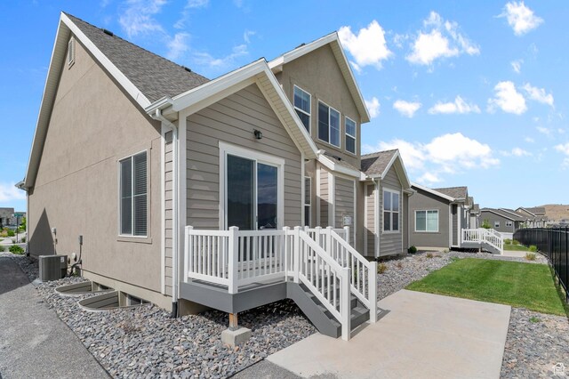 1282 E Clipper Peaks, Eagle Mountain, UT 84005 - rear view of property with a patio, a residential view, a wooden deck, and stucco siding