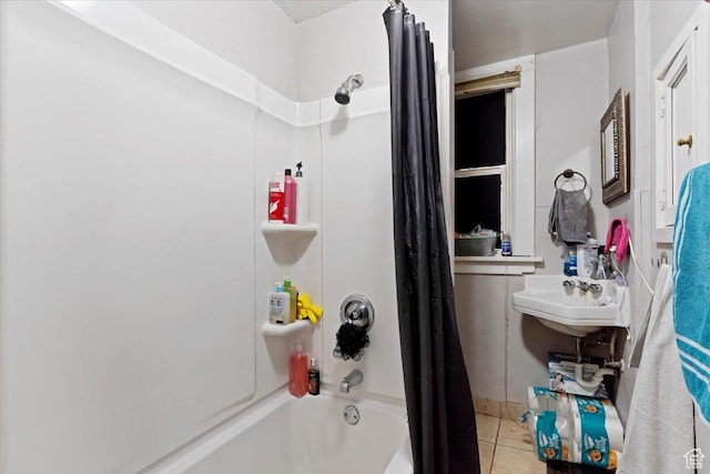 bathroom featuring tile patterned flooring and shower / bathtub combination with curtain
