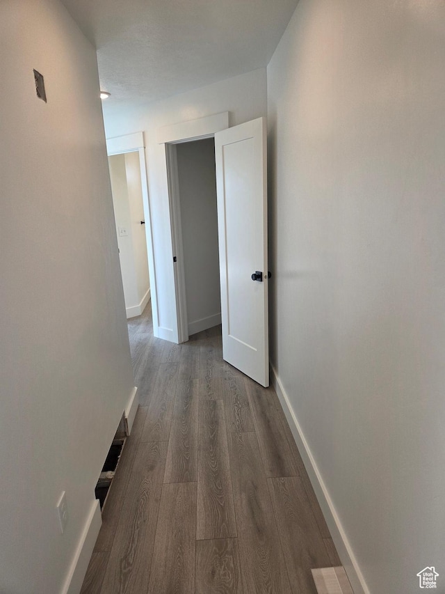 640 S 1030 E, Smithfield, UT 84335 - hallway featuring wood finished floors and baseboards