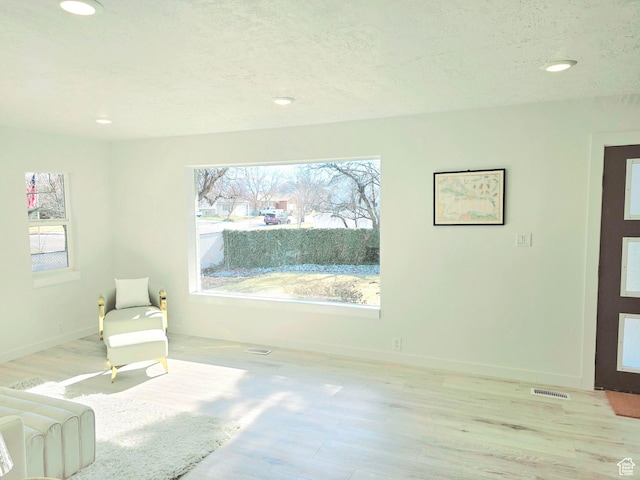 bedroom with multiple windows, baseboards, wood finished floors, and recessed lighting