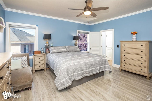 bedroom with ceiling fan, light hardwood / wood-style flooring, and crown molding
