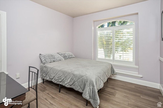 bedroom with wood-type flooring