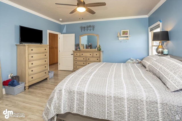 bedroom featuring ornamental molding, ceiling fan, and light hardwood / wood-style flooring
