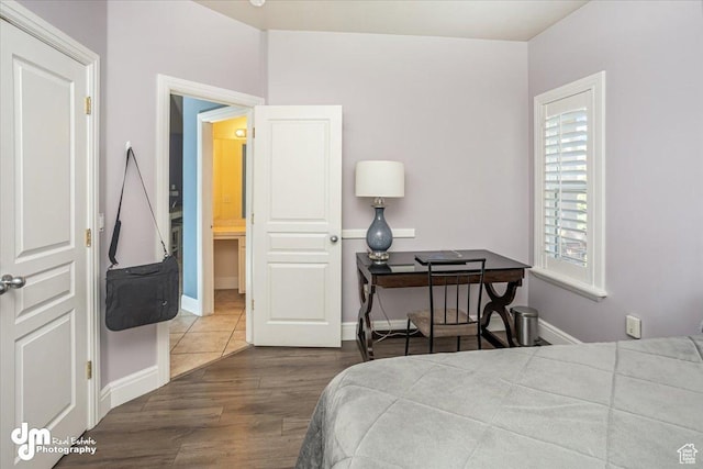 bedroom with hardwood / wood-style flooring