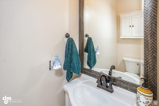 bathroom with sink and toilet