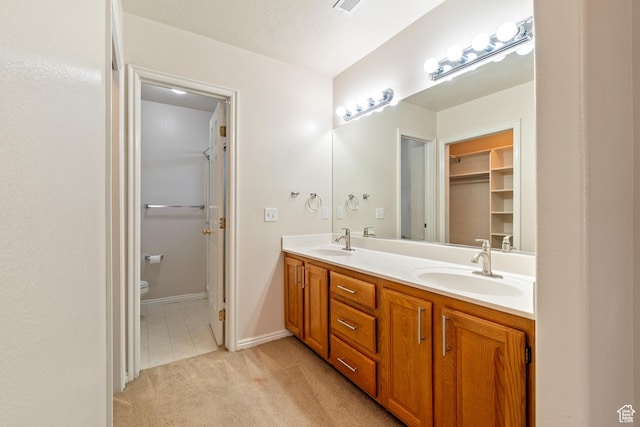 1040 S 1100 E Unit 85, St George, UT 84790 - bathroom with a textured ceiling, toilet, and vanity