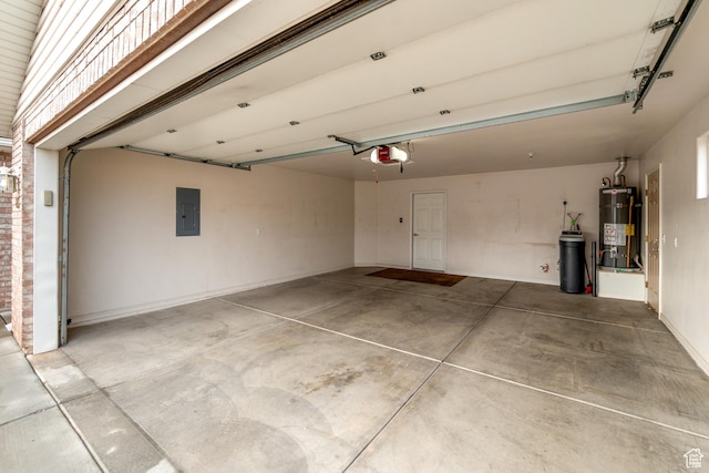 1040 S 1100 E Unit 85, St George, UT 84790 - garage with strapped water heater, electric panel, and a garage door opener