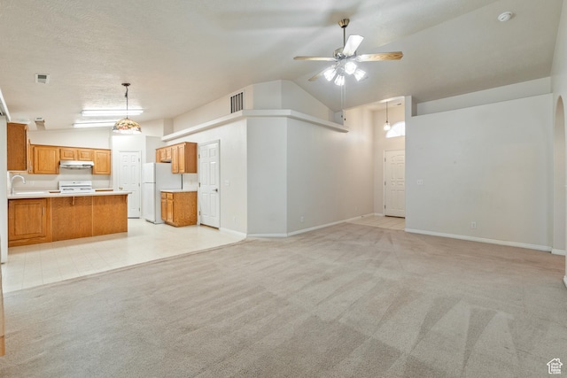 1040 S 1100 E Unit 85, St George, UT 84790 - unfurnished living room with ceiling fan, sink, high vaulted ceiling, and light carpet
