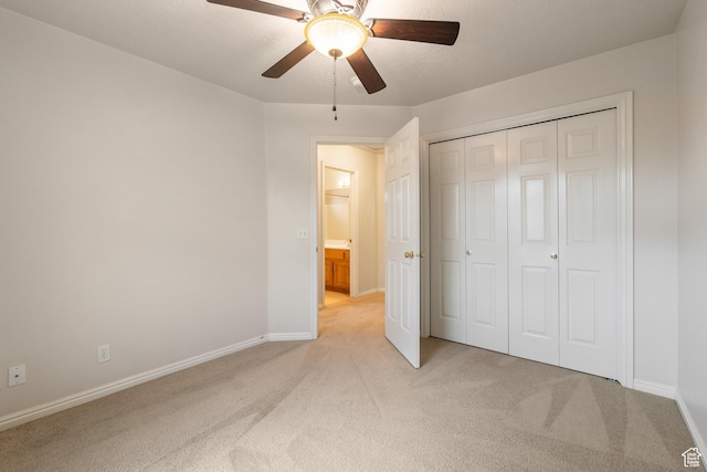 1040 S 1100 E Unit 85, St George, UT 84790 - unfurnished bedroom featuring ceiling fan, a closet, a textured ceiling, and light colored carpet