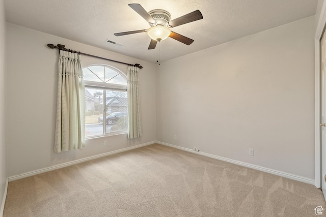 1040 S 1100 E Unit 85, St George, UT 84790 - spare room featuring a textured ceiling, light colored carpet, and ceiling fan