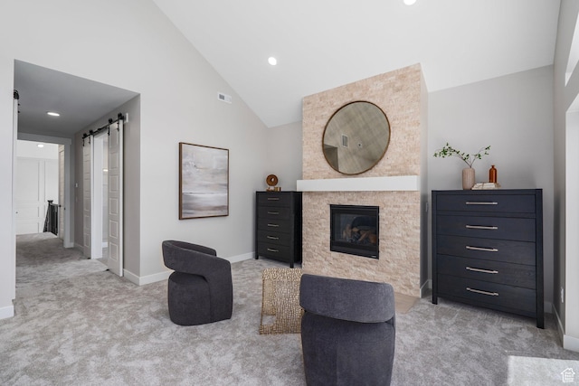 250 S Main St Unit 7, Alpine, UT 84004 - interior space with a barn door, high vaulted ceiling, and light colored carpet