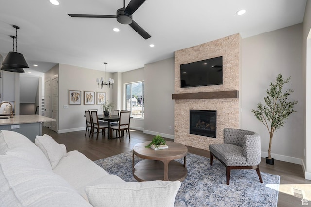 250 S Main St Unit 7, Alpine, UT 84004 - living room with ceiling fan with notable chandelier, dark hardwood / wood-style flooring, a stone fireplace, and sink