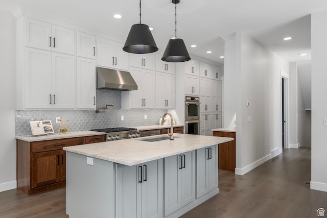 250 S Main St Unit 7, Alpine, UT 84004 - kitchen with a center island with sink, sink, hanging light fixtures, and white cabinets