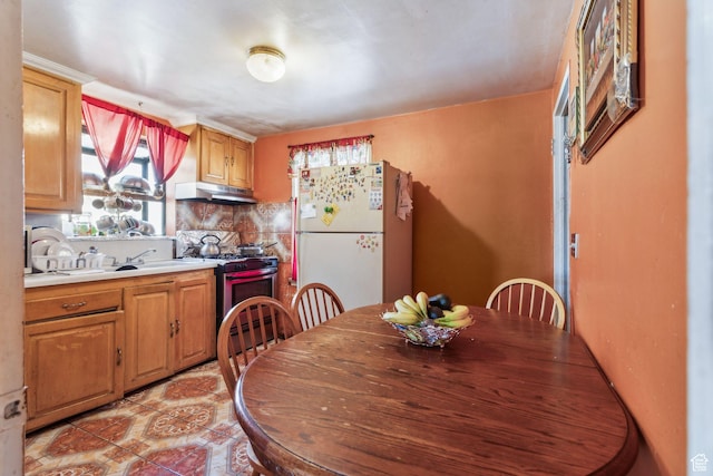 804 W 600 N, Salt Lake City, UT 84116 - kitchen with gas range, sink, white fridge, light tile patterned flooring, and decorative backsplash
