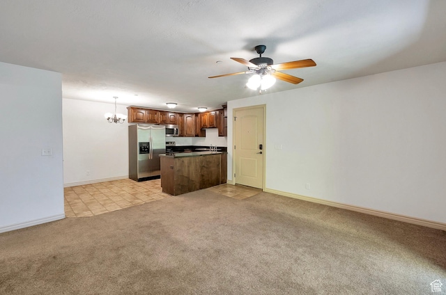 289 S 1000 W Unit 203, Pleasant Grove, UT 84062 - kitchen with kitchen peninsula, stainless steel appliances, pendant lighting, light carpet, and ceiling fan with notable chandelier