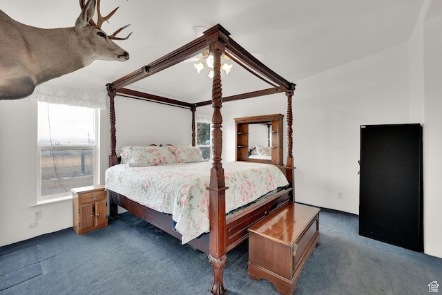 bedroom featuring carpet floors, multiple windows, a ceiling fan, and lofted ceiling