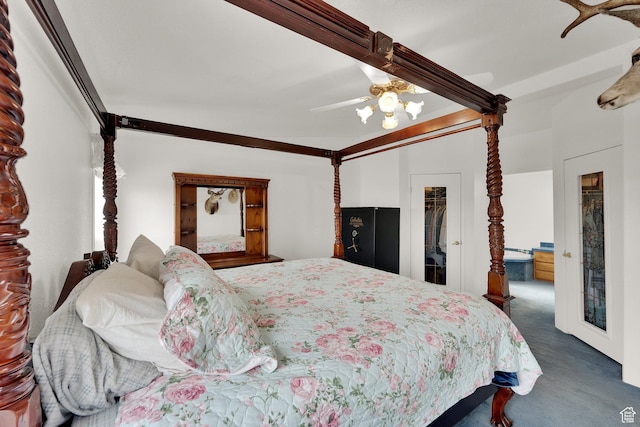 bedroom with carpet floors, a ceiling fan, and a closet