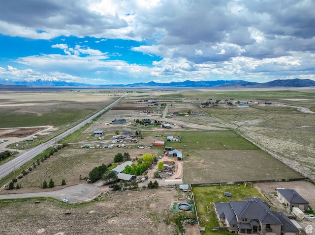 aerial view of sparsely populated area with a mountain backdrop