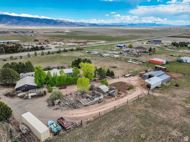 aerial view of sparsely populated area with a mountain backdrop