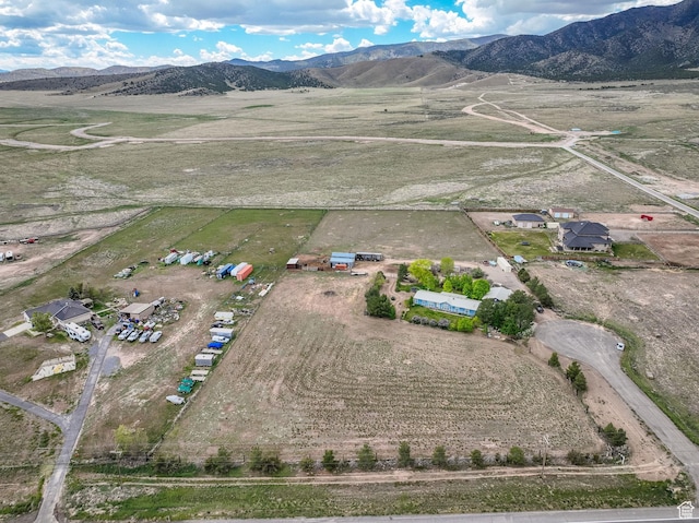 aerial view of sparsely populated area featuring a mountainous background