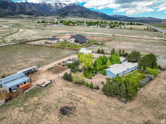 aerial view of sparsely populated area featuring a mountainous background
