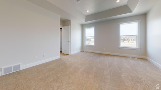 9270 N 5600 W Unit 7, Elwood, UT 84337 - unfurnished room featuring a tray ceiling, visible vents, light carpet, and baseboards
