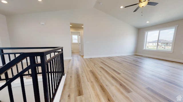 9270 N 5600 W Unit 7, Elwood, UT 84337 - empty room featuring light wood-style floors, a healthy amount of sunlight, vaulted ceiling, and baseboards
