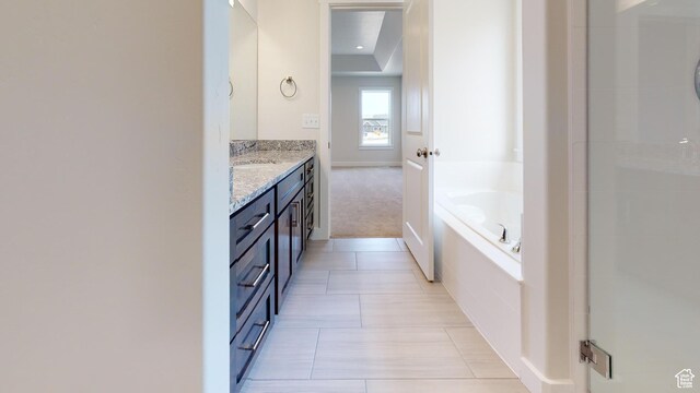 9270 N 5600 W Unit 7, Elwood, UT 84337 - bathroom with an enclosed shower, tile patterned flooring, vanity, and a bath