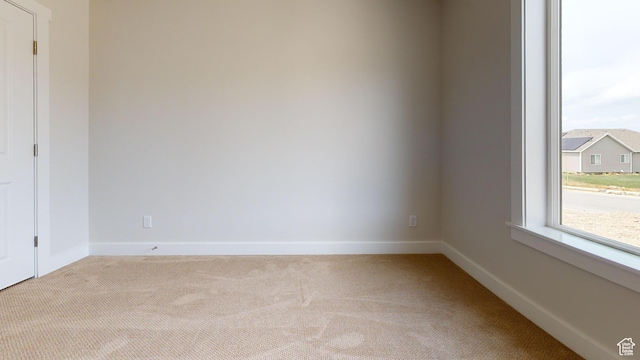 9270 N 5600 W Unit 7, Elwood, UT 84337 - unfurnished room featuring light carpet and baseboards