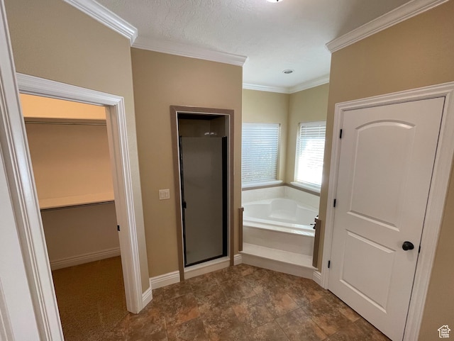 bathroom with crown molding and independent shower and bath