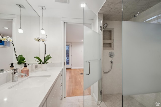 5419 S Kenwood Dr E, Salt Lake City, UT 84107 - bathroom with walk in shower, vanity, and wood finished floors