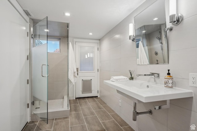 5419 S Kenwood Dr E, Salt Lake City, UT 84107 - full bath featuring a shower stall, tile walls, and recessed lighting