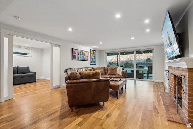 5419 S Kenwood Dr E, Salt Lake City, UT 84107 - living area with light wood-type flooring, recessed lighting, a fireplace, and baseboards