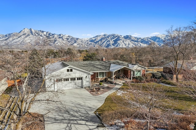 5419 S Kenwood Dr E, Salt Lake City, UT 84107 - single story home featuring a garage, driveway, covered porch, and a mountain view