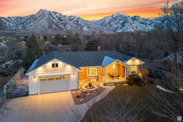 view of front of house with a garage and a mountain view