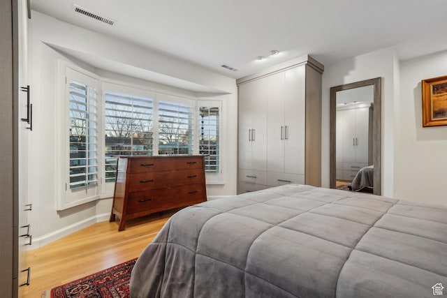 5419 S Kenwood Dr E, Salt Lake City, UT 84107 - bedroom with light wood-style floors and baseboards