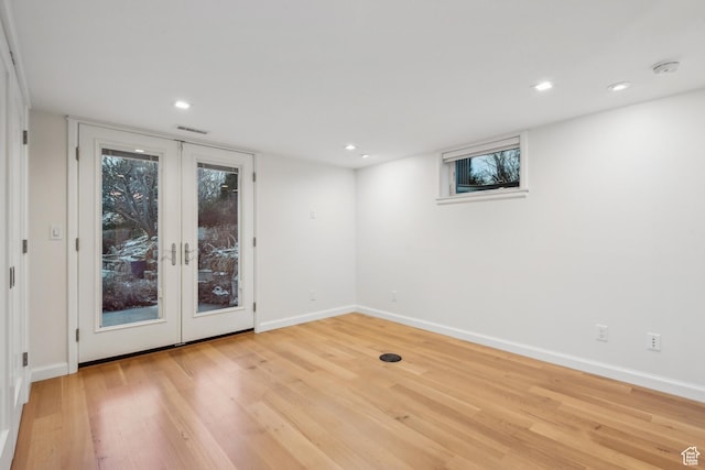 5419 S Kenwood Dr E, Salt Lake City, UT 84107 - spare room featuring french doors, light wood-style flooring, baseboards, plenty of natural light, and recessed lighting