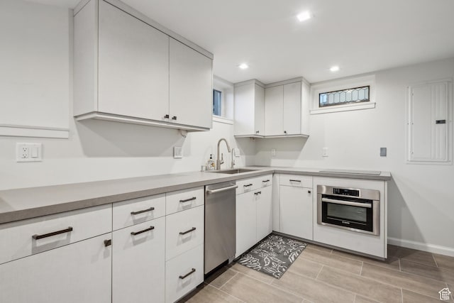 5419 S Kenwood Dr E, Salt Lake City, UT 84107 - kitchen with appliances with stainless steel finishes, a sink, white cabinetry, recessed lighting, and electric panel